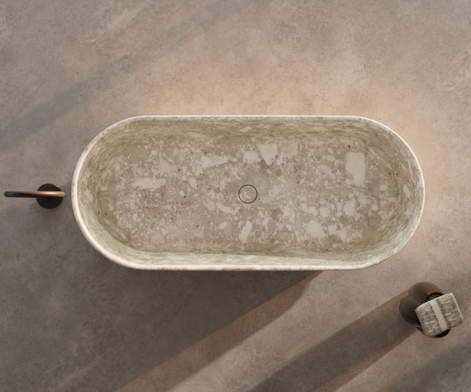 Natural marble freestanding soaking tub with authentic stone veining