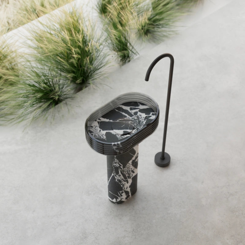 Black marble bathroom pedestal sink with transparent acrylic