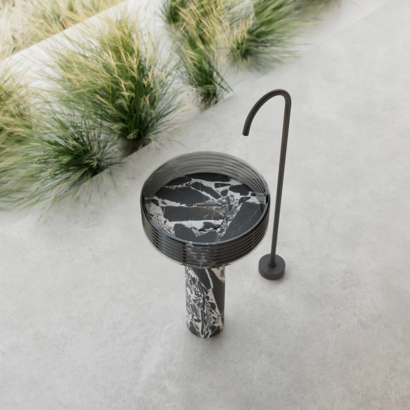 Black marble bathroom pedestal sink with transparent acrylic