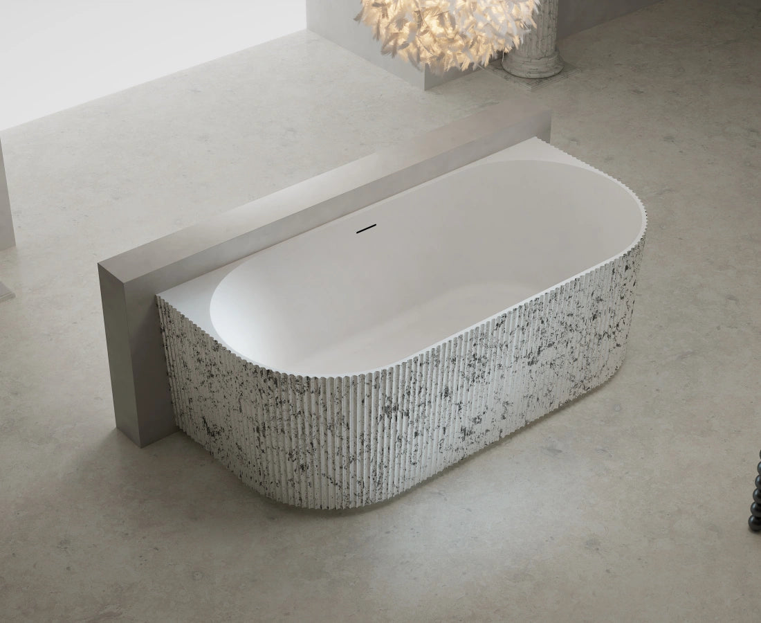 Modern fluted solid surface back to wall soaking bathtub with center drain
