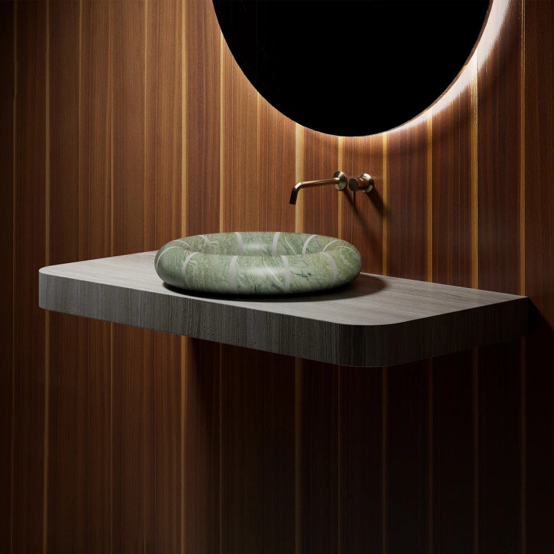 MonBlari green marble countertop vessel sink with sculptural disc shape