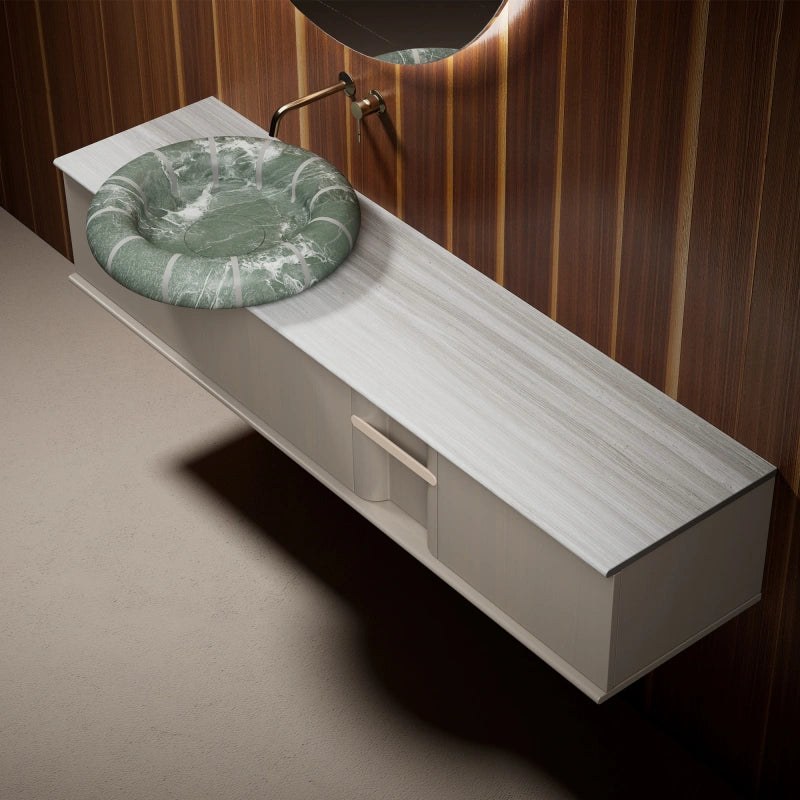 Green marble vessel sink with white stripes and modern vanity cabinet