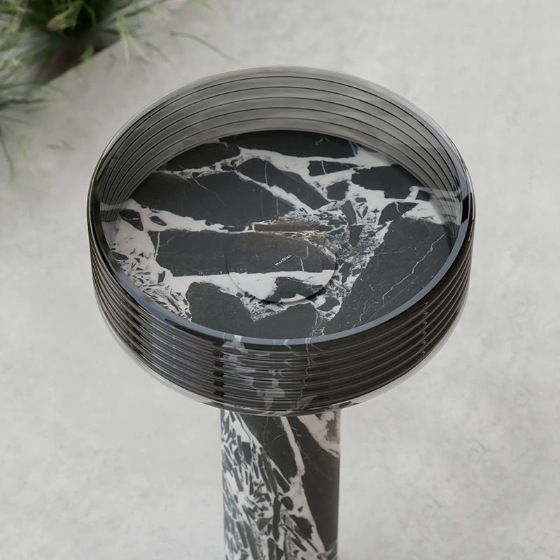 Sculptural black marble pedestal sink for modern bathroom