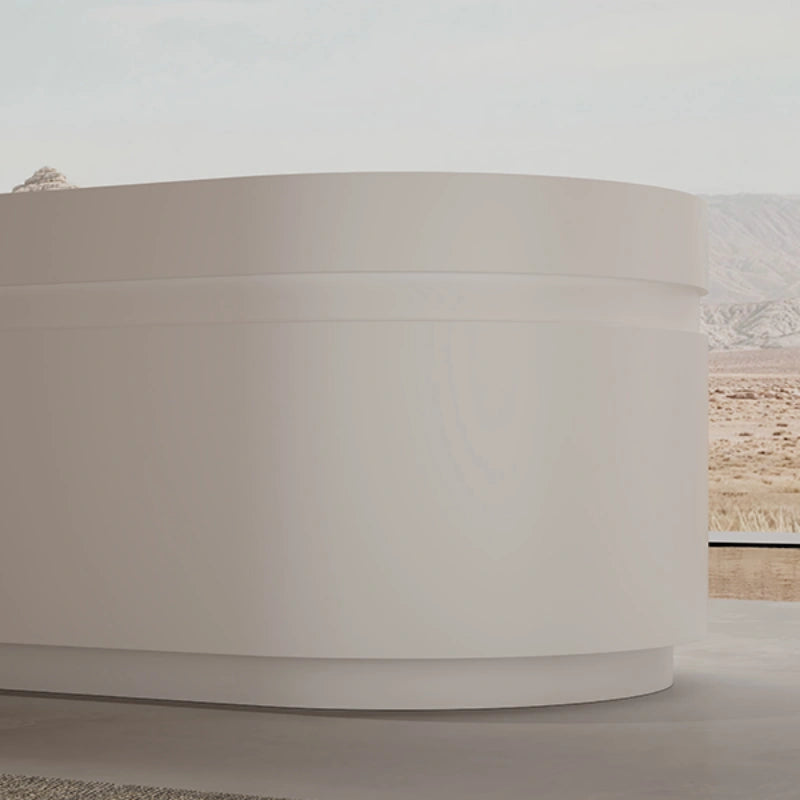 Modern freestanding soaking tub in matte white for spa-inspired bathroom