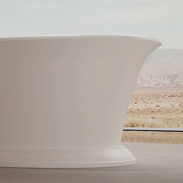 Modern standalone stone bathtub with internal drain for spa-inspired bathroom
