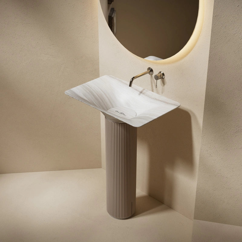 Natural marble freestanding bathroom sink with integrated pedestal