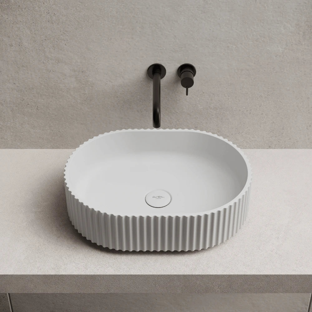 Modern white countertop basin with oval shape for elegant bathroom