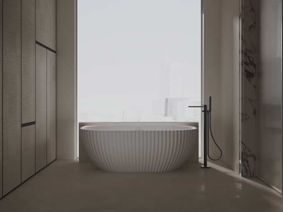 Load video: freestanding bath featuring a textured exterior surface