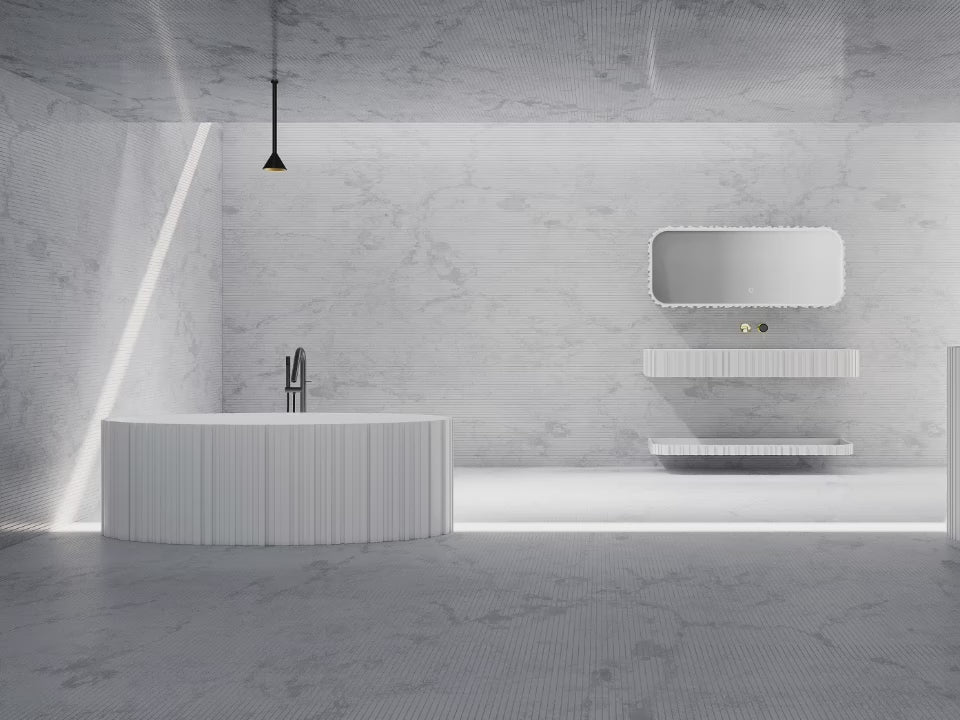 Load video: Statement bathtub featuring fluted solid surface design