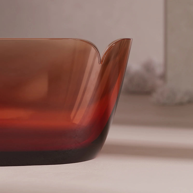 Person relaxing in a deep modern resin bathtub for soaking
