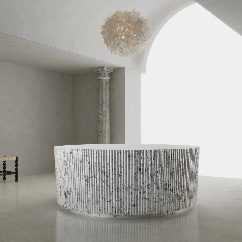 Fluted freestanding soaking tub with matte white stone resin finish