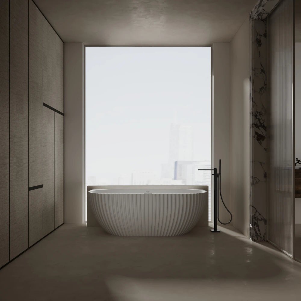 white oval bathtub designed for back to wall installation
