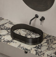 STRATA marble-inspired vessel sink with clear acrylic