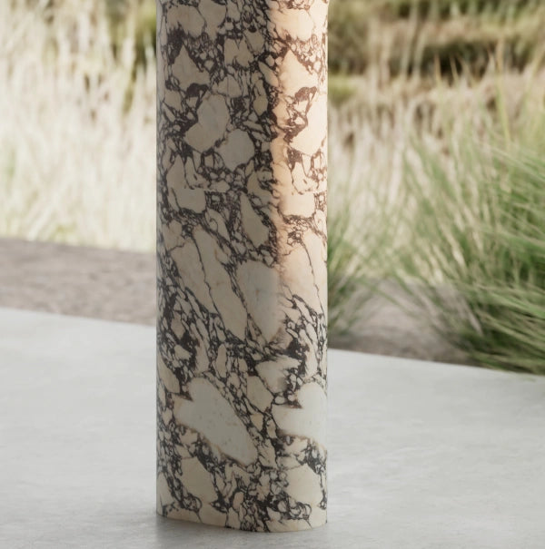 Natural marble pedestal sink with acrylic overlay and faceted detailing