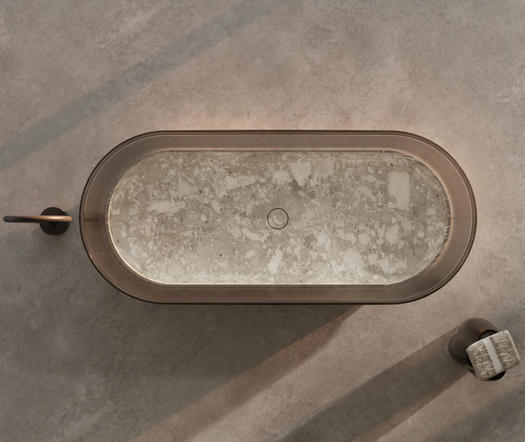 Montage marble freestanding soaking tub with translucent element