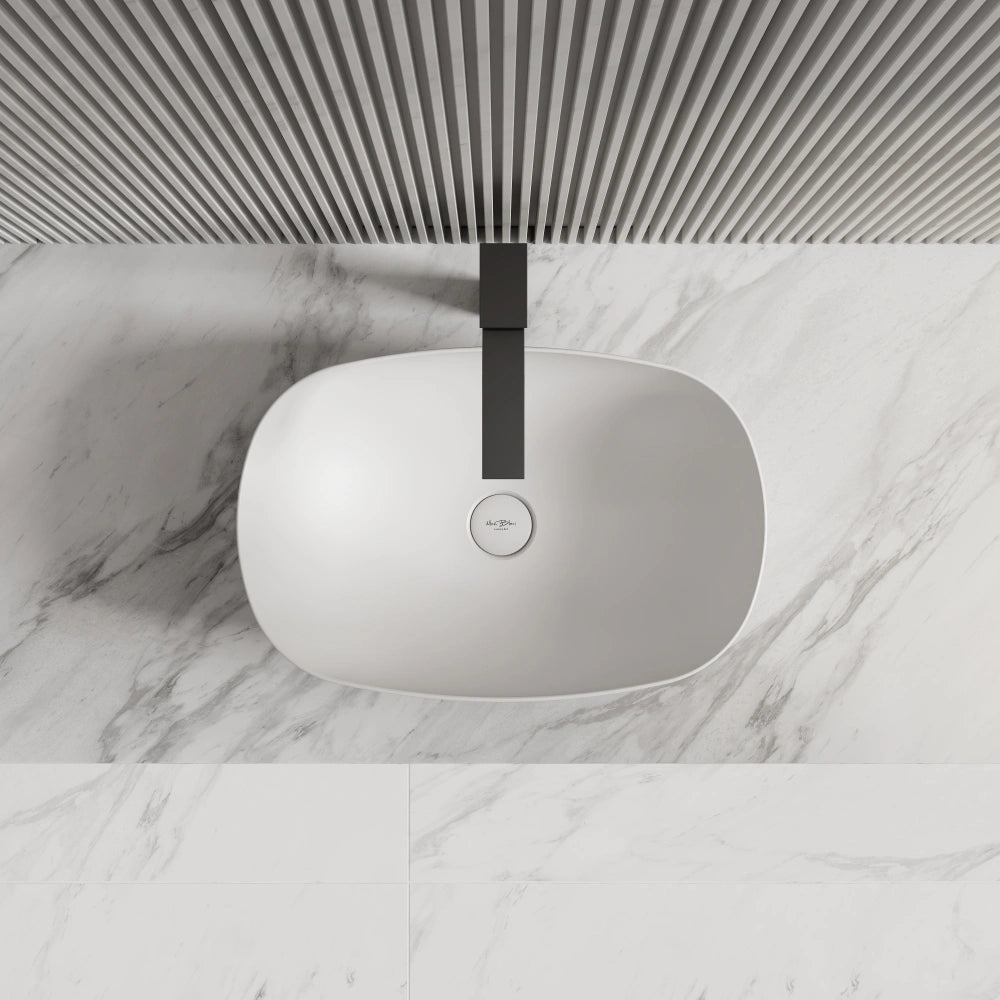 Elegant matte white bathroom vessel sink top view with clean oval lines