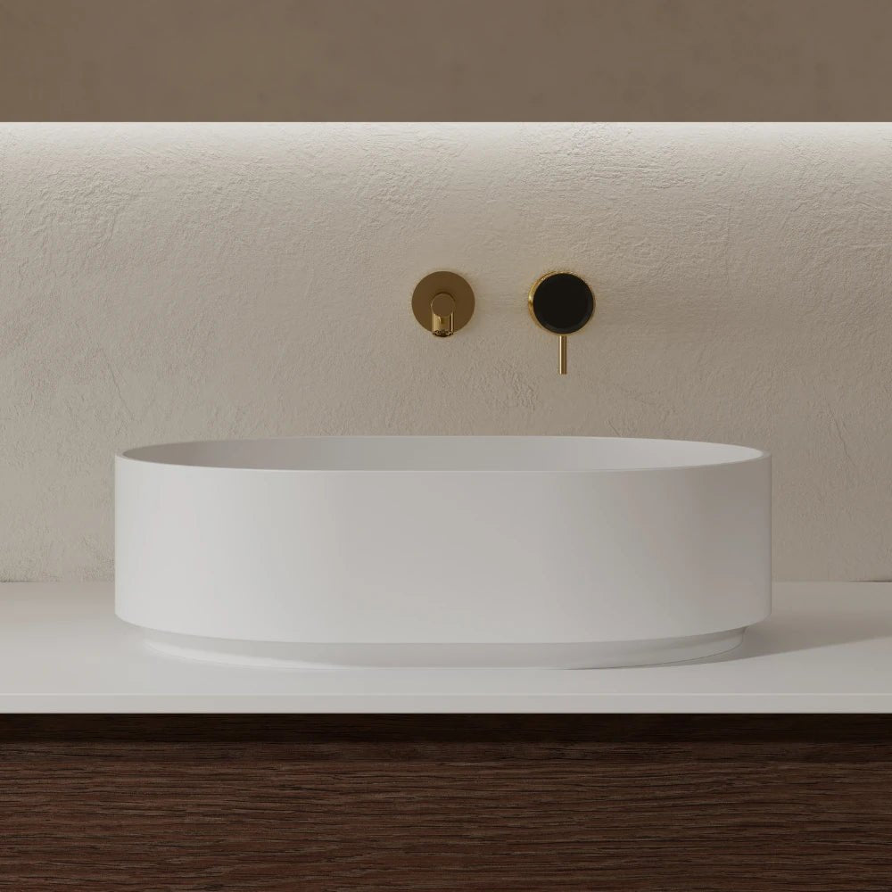 White oval bathroom vessel sink with clean lines