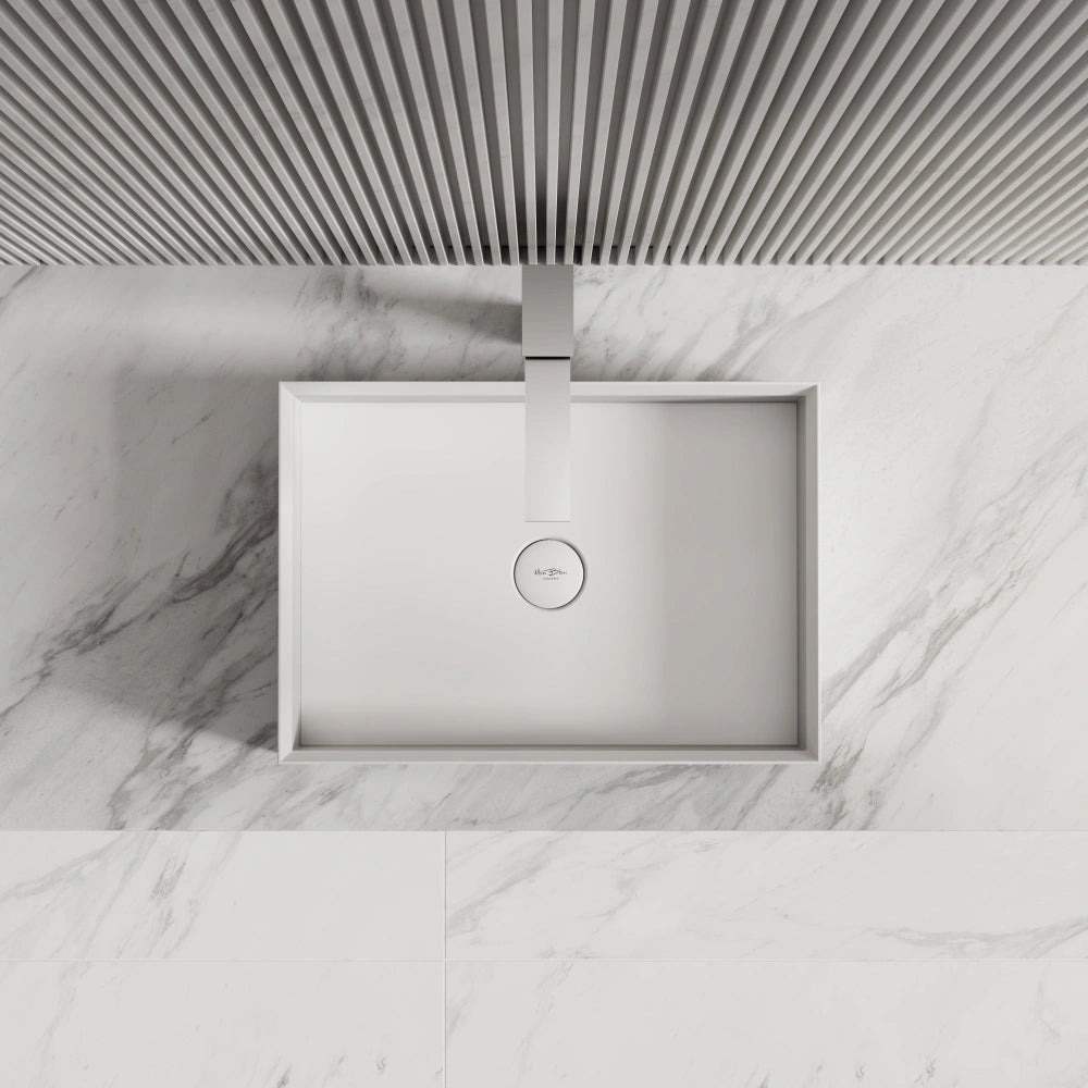 White rectangular solid surface countertop wash basin