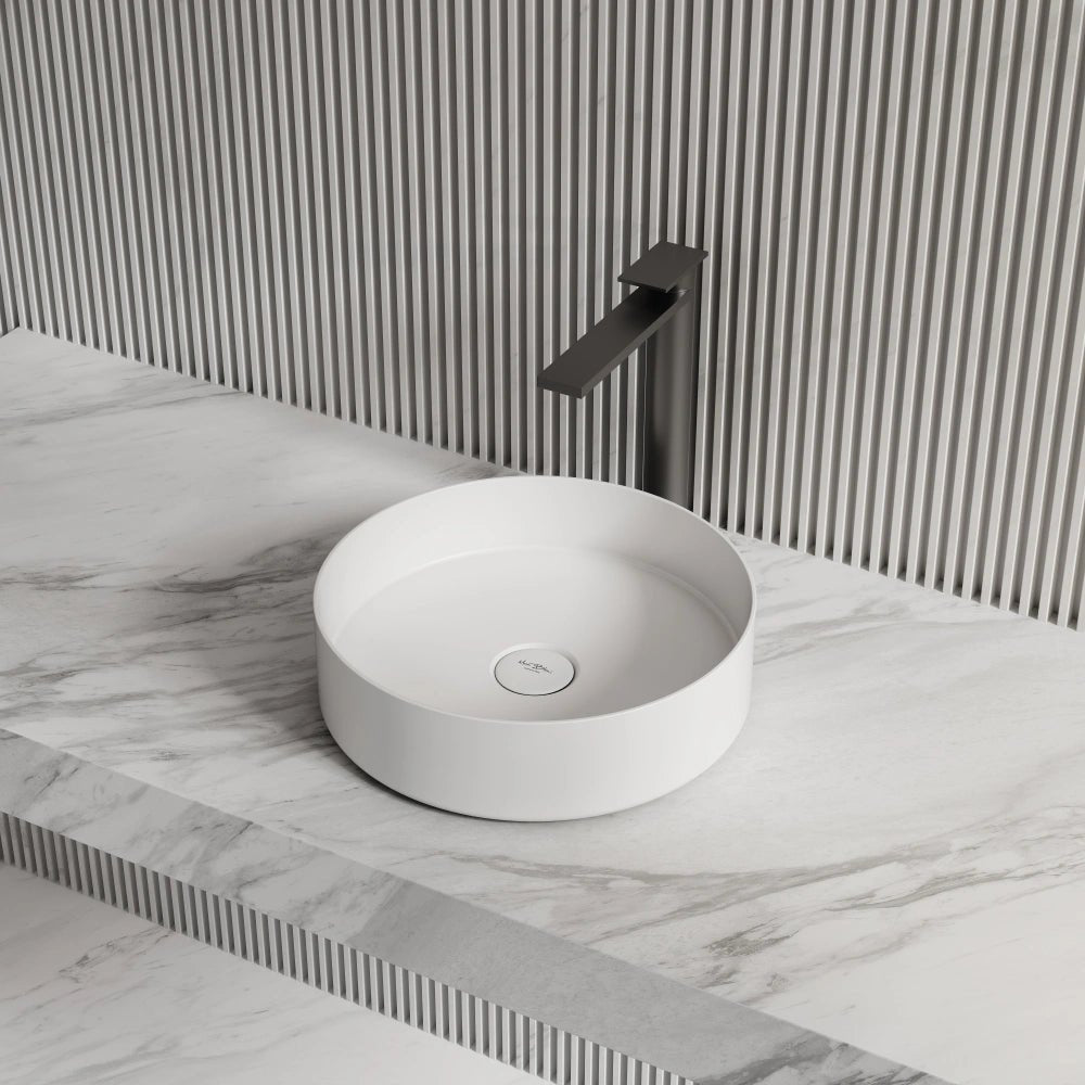 White round solid surface bathroom sink side top view close-up