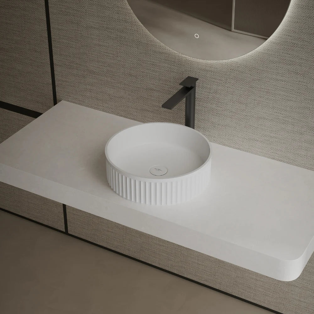 Solid surface vessel sink