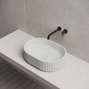 White oval bathroom sink for modern countertop installation